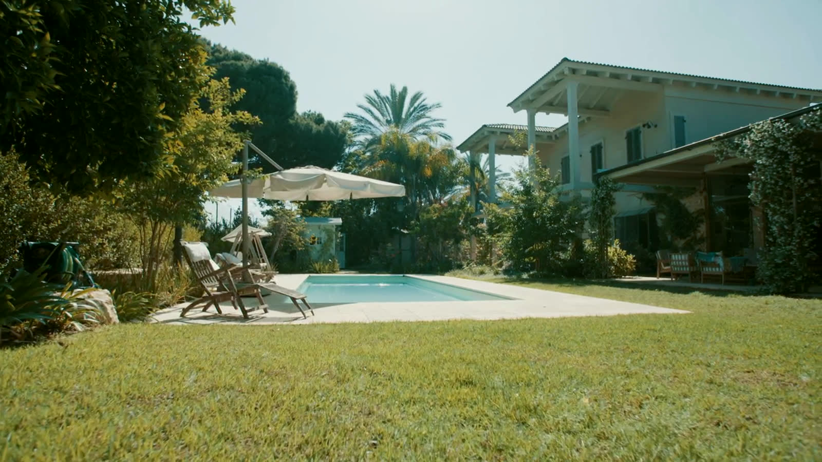 The pool terrace in afternoon light